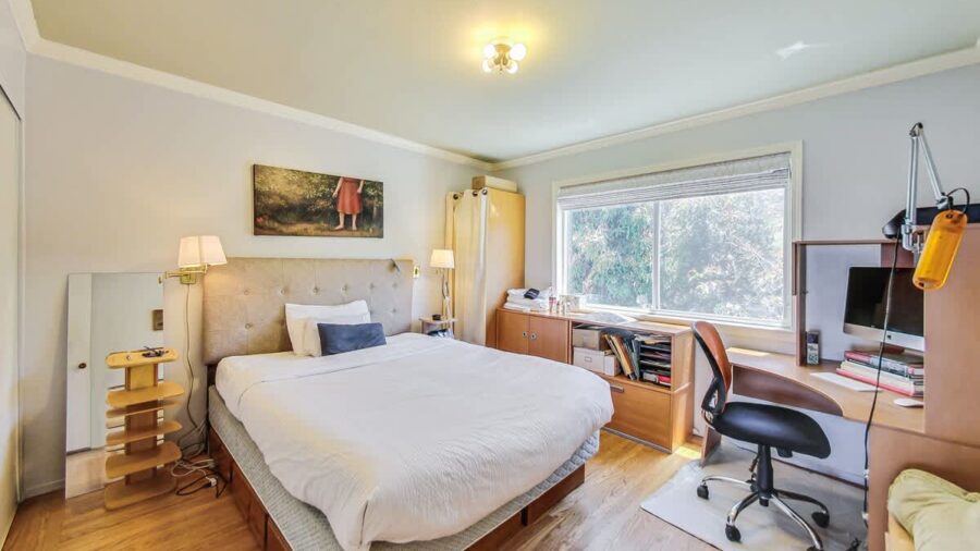 Main bedroom has a comfy bed and a desk to work.