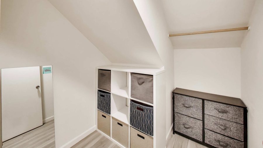Small bedroom walk-in closet.